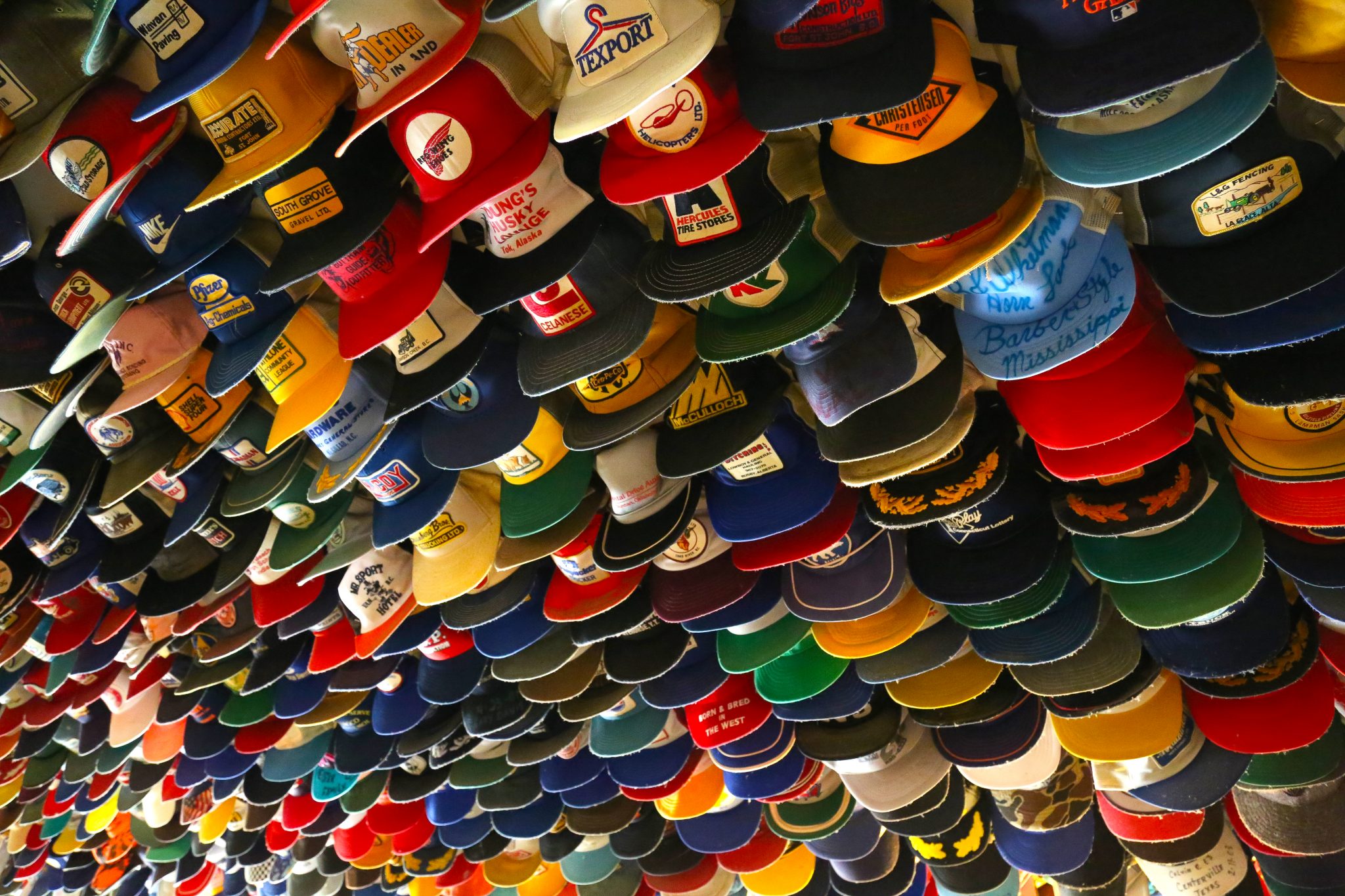 Ceiling of hats, Toad River Lodge cafe, British Columbia, Canada