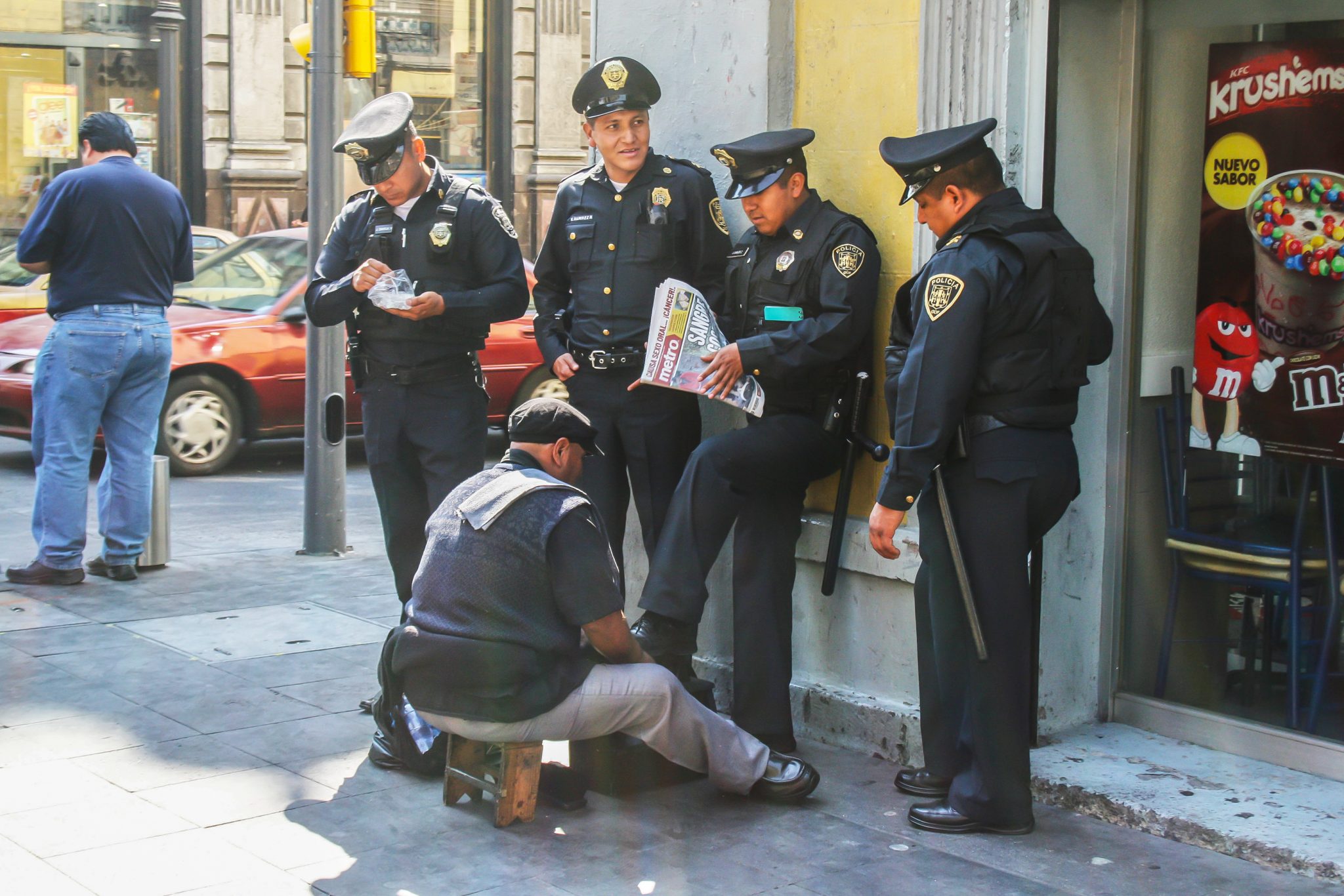 Policemen and shoeshine man, Mexico City, Mexico