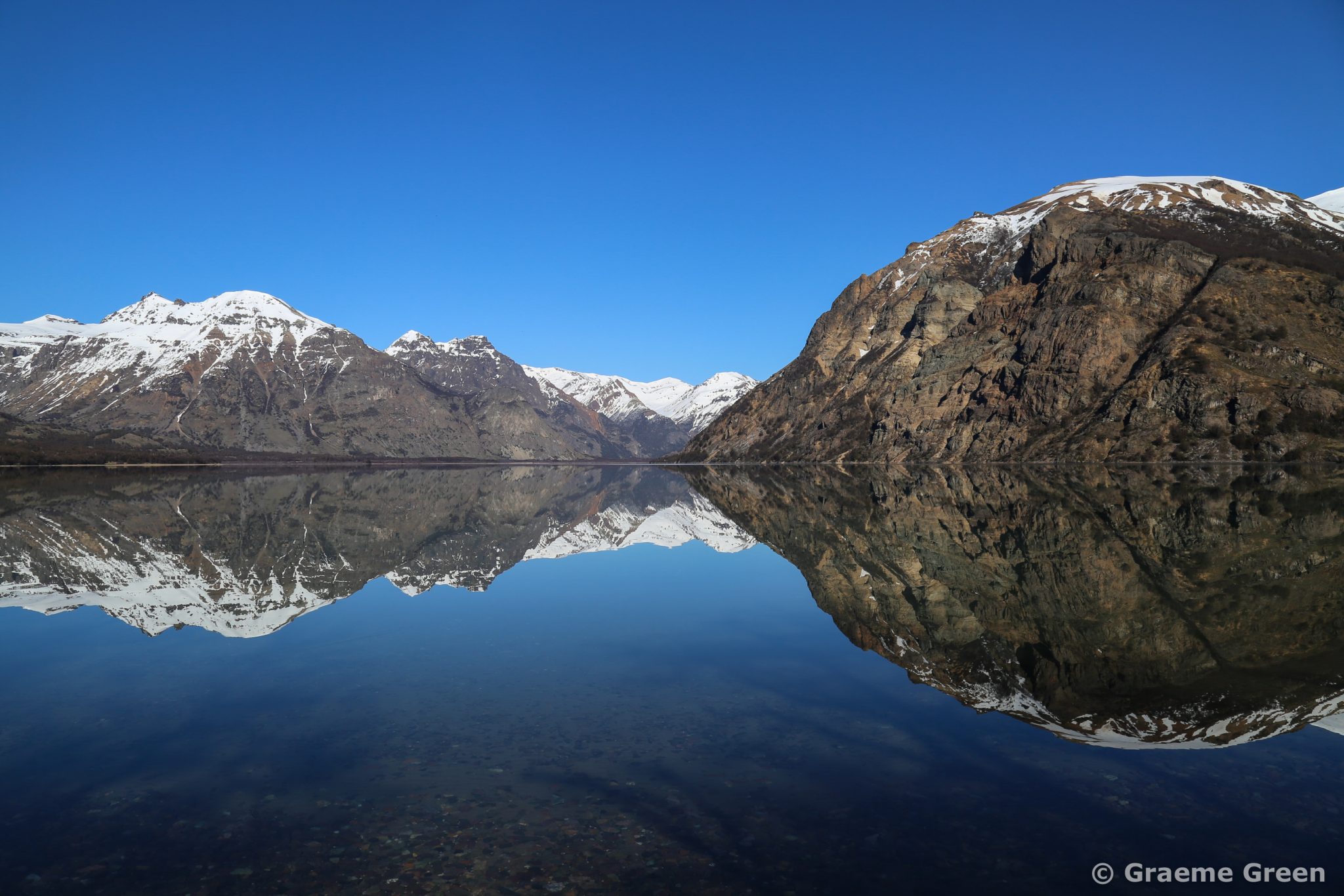 Mirror images in the still waters of Lago Jeinemeni in Aysen in Patagonia, Chile.